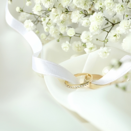 concept-wedding-accessories-with-wedding-rings-close-up