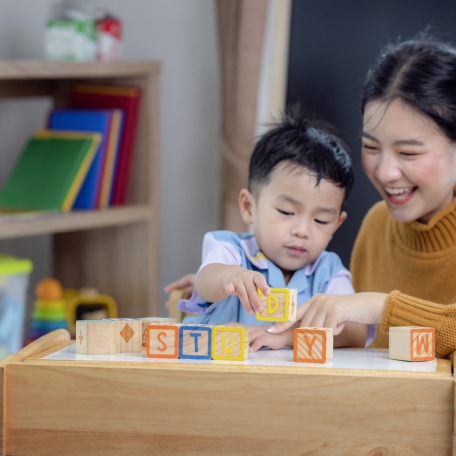 asian-student-preschool-use-letter-box-make-study-word-class-room-with-his-teacher (2)