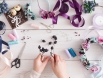 master-making-handmade-jewelry-top-view-needlewoman-workplace-with-plastic-beads-flowers-tools-creating-accessories